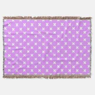 White cross stitches on lilac throw blanket