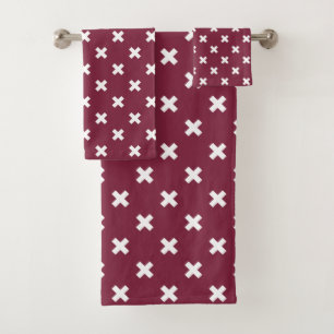 White cross stitches on mulberry bath towel set