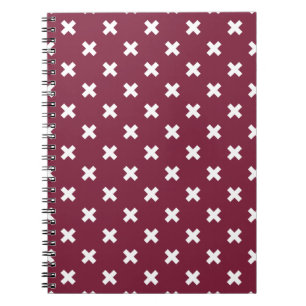 White cross stitches on mulberry notebook