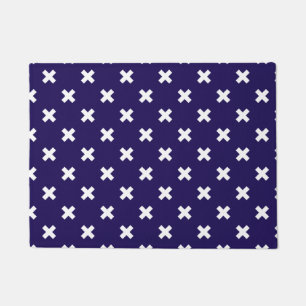 White cross stitches on navy blue doormat