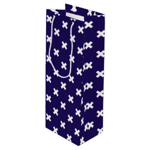 White cross stitches on navy blue wine gift bag