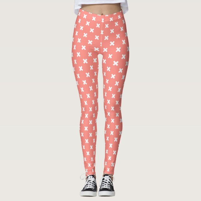 White cross stitches on peach leggings (Front)