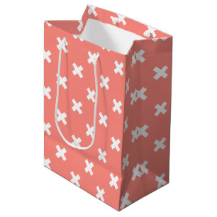 White cross stitches on peach medium gift bag