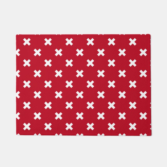 White cross stitches on red doormat (Front)