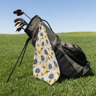 White daisies, wild flowers on yellow golf towel