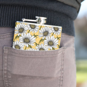 White daisies, wild flowers on yellow hip flask