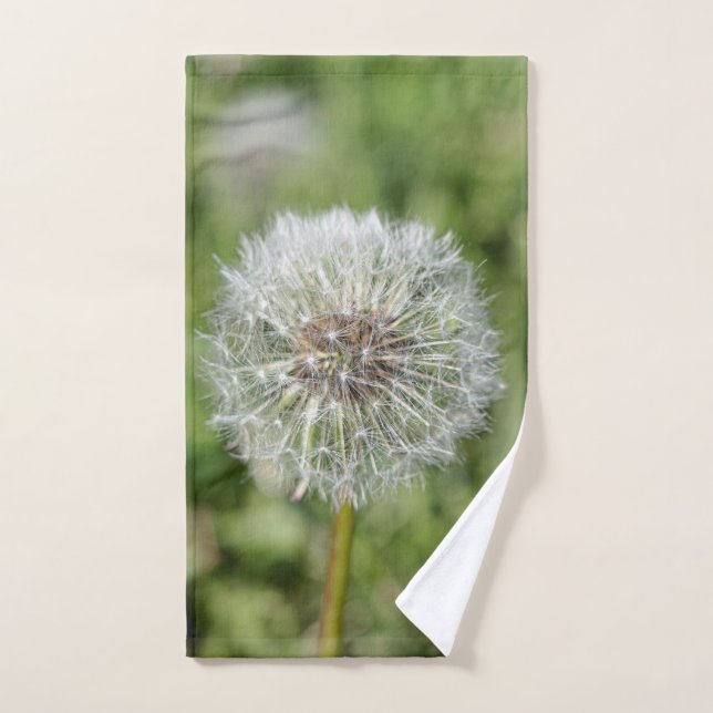 White dandelion flower on green grass hand towel (Hand Towel)