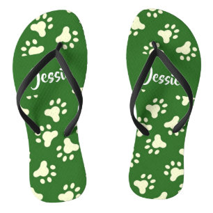 White dog paws on green jandals
