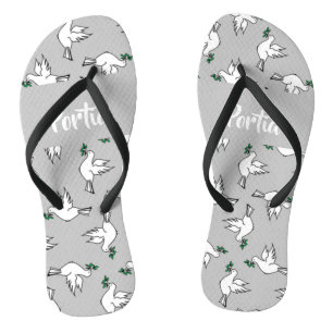 White dove with green leaves on grey jandals