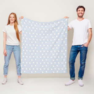 white doves on blue fleece blanket