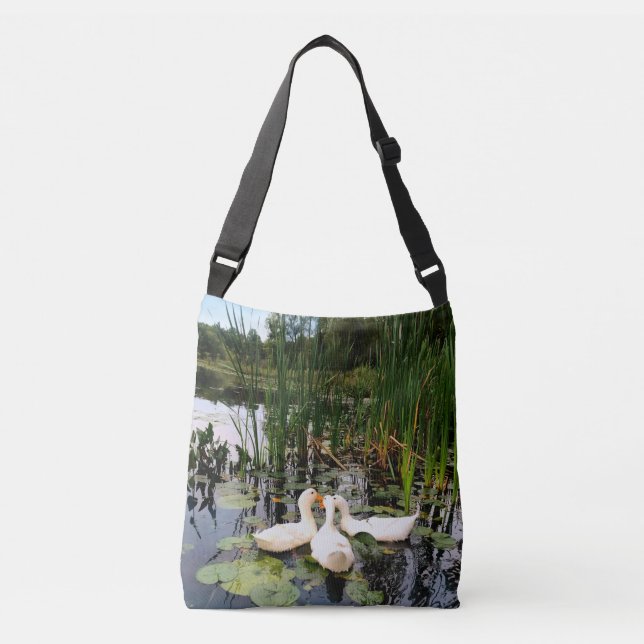 White ducks, lily pads, cattails, lake shore crossbody bag (Front)