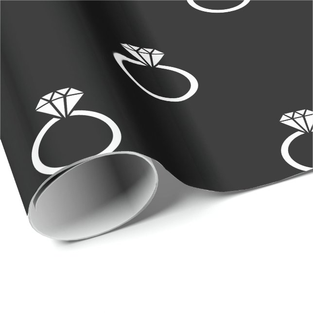 White Engagement Rings on Black Wrapping Paper (Roll Corner)