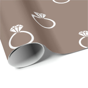 White Engagement Rings on Taupe Brown Wrapping Paper