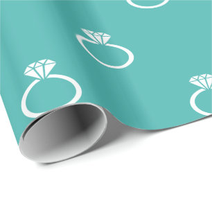 White Engagement Rings on Verdigris Wrapping Paper