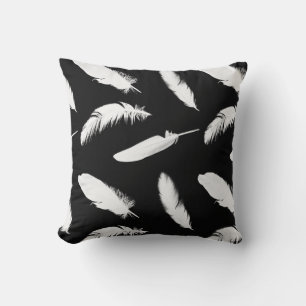 White feather print on black cushion
