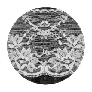 White floral lace: black background. cutting board