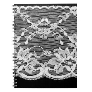 White floral lace: black background. notebook