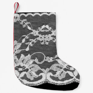 White floral lace: black background. small christmas stocking