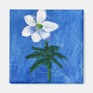white flower on blue painting magnet