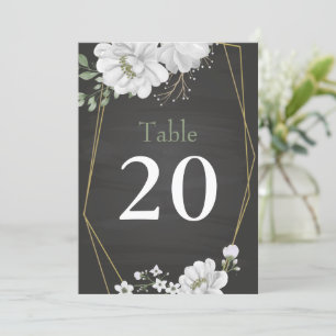 white flowers greenery black table number