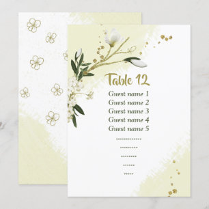 white flowers greenery seating chart table number
