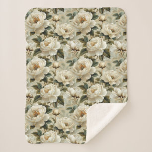 White flowers on a cream background.  sherpa blanket