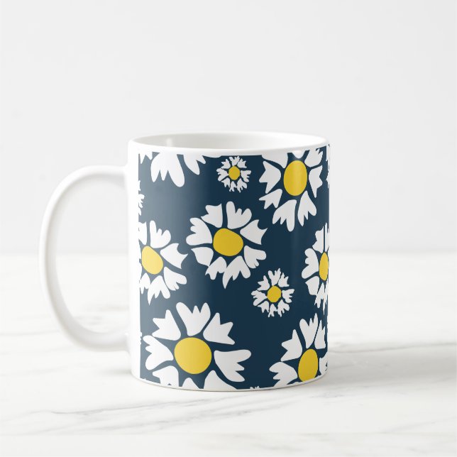 White flowers, yellow centre, on blue background coffee mug (Left)