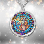 White Gold Unicorn Stained Glass Silver Plated Necklace<br><div class="desc">On this pretty necklace is a stunning image of a white unicorn with a gold orange mane,  presented on a blue background. The unicorn,  background,  and border are shown in a stained glass style. Elegant! Be sure to see the matching earrings and key chain in our store.</div>