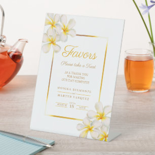 White golden frangipani tropical wedding favours pedestal sign