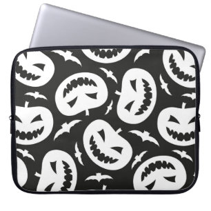 White halloween pumpkins and bats isolated on blac laptop sleeve