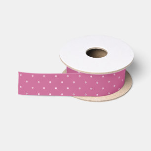 White hearts on pink satin ribbon for wrapping
