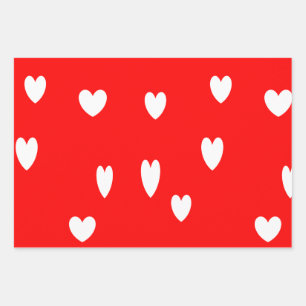 White hearts on red wrapping paper sheet