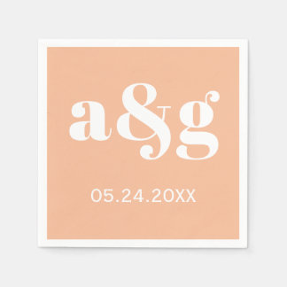 White initials typography on coral peach wedding napkin