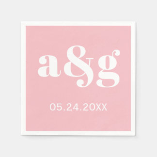 White initials typography on pink wedding napkin