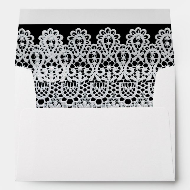 White lace forms a delicate border against black envelope (Back (Bottom))