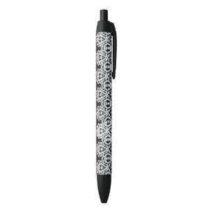 White lace forms a delicate border against black ink pen