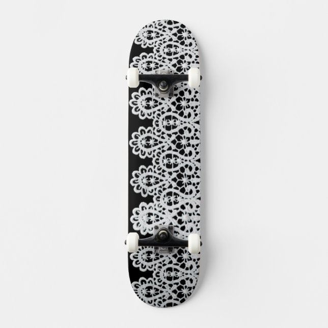 White lace forms a delicate border against black skateboard (Front)