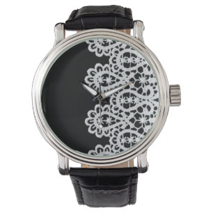 White lace forms a delicate border against black watch