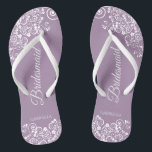 White Lace on Dusty Purple Bridesmaid Wedding Jandals<br><div class="desc">These beautiful wedding flip flops are a great way to thank and recognise your bridesmaids while saving their feet at the same time. Features an elegant design with white floral lace filigree on a dusty purple, lilac, or lavender coloured background. The elegant script lettering reads Bridesmaid with her name below....</div>