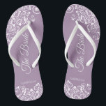 White Lace on Dusty Purple The Bride Wedding Jandals<br><div class="desc">Dance the night away with these beautiful wedding flip flops. Designed for the bride, they feature a simple yet elegant design with fancy script lettering on a dusty purple, lavender, or lilac coloured background and white lace curls and swirls. Beautiful way to stay fancy and appropriate while giving your feet...</div>