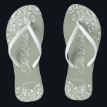 White Lace on Sage Green The Bride Elegant Wedding Jandals<br><div class="desc">Dance the night away with these beautiful wedding flip flops. Designed for the bride, they feature a simple yet elegant design with fancy script lettering on a sage green background and white lace curls and swirls. Beautiful way to stay fancy and appropriate while giving your feet a break after a...</div>