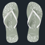 White Lace on Sage Green The Bride Elegant Wedding Jandals<br><div class="desc">Dance the night away with these beautiful wedding flip flops. Designed for the bride, they feature a simple yet elegant design with fancy script lettering on a sage green background and white lace curls and swirls. Beautiful way to stay fancy and appropriate while giving your feet a break after a...</div>