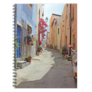 WHITE MOTOR SCOOTER NEAR BUILDING NOTEBOOK