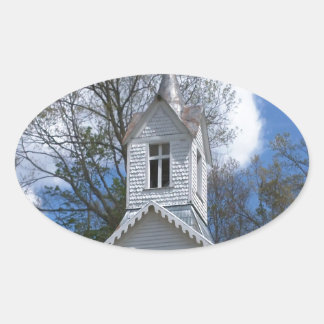 white old church in the mountains oval sticker