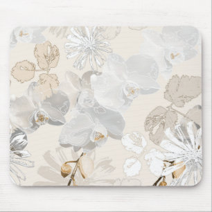White orchids on a light cream mouse pad