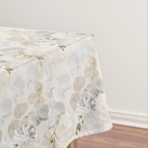 White orchids on a light cream  tablecloth