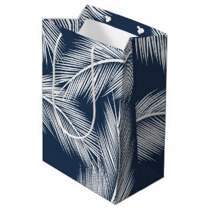 White palm leaves on dark blue colour background medium gift bag