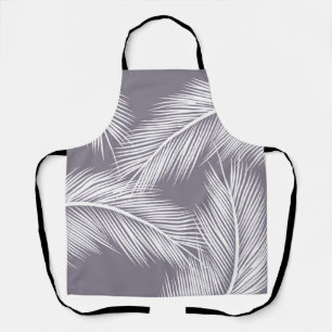 White palm leaves on purple colour background apron