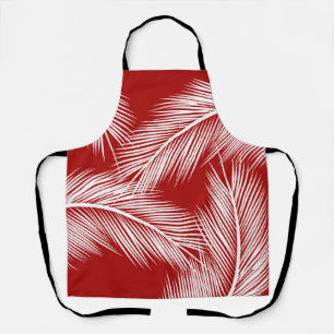 White palm leaves on red colour background apron