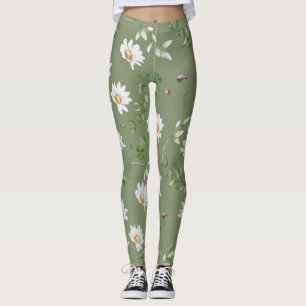 White petal flower on olive green background leggings